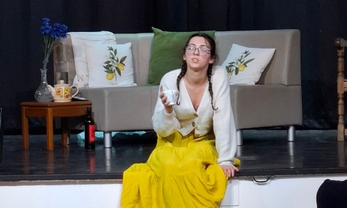 Student performing a play