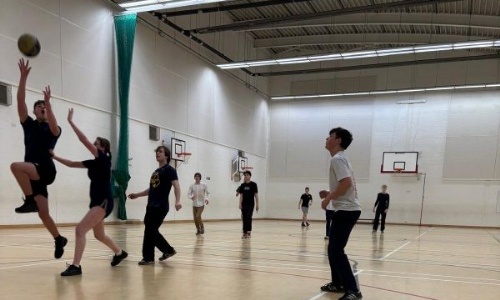 students playing basketball match